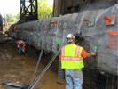 image of large concrete slab with construction workers by it